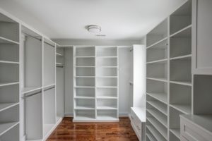A spacious master walk-in closet.